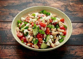 Bean Salad with Cherry Tomatoes, Cucumber, Red onion, Feta cheese and parsley. Healthy vegetarian, vegan diet food