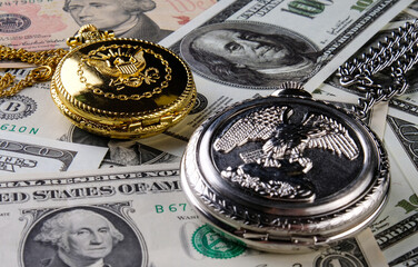 Pocket watch and money on the table