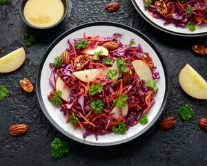 Red Cabbage salad with carrots, apples and pecan nuts. Healthy vegan food