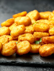 Mini hash browns, tater tots crispy golden potato bites served with jalapeno peppers dipped in ketchup