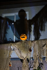 Scary Halloween Scarecrow Casting a Shadow against wall