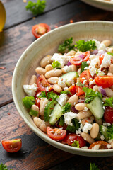 Bean Salad with Cherry Tomatoes, Cucumber, Red onion, Feta cheese and parsley. Healthy vegetarian, vegan diet food
