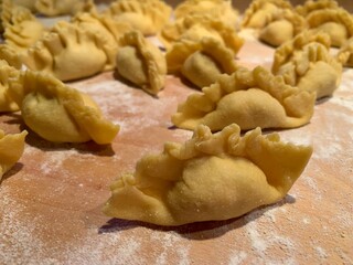Fototapeta na wymiar fresh homemade ravioli dumplings with semolina flour