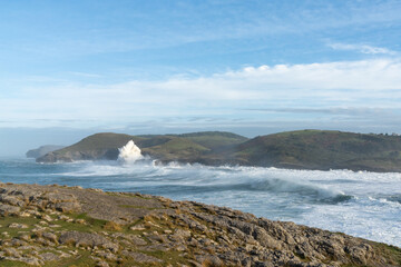 huge waves crashing onto the shores of Cabo de Ajo on the northern Spanish coast