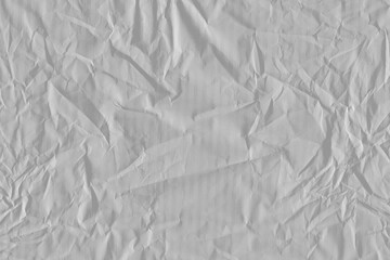 White vintage and old looking crumpled paper background. Retro cardboard texture. Grunge paper for drawing. Ancient book page. Present wrapping.
