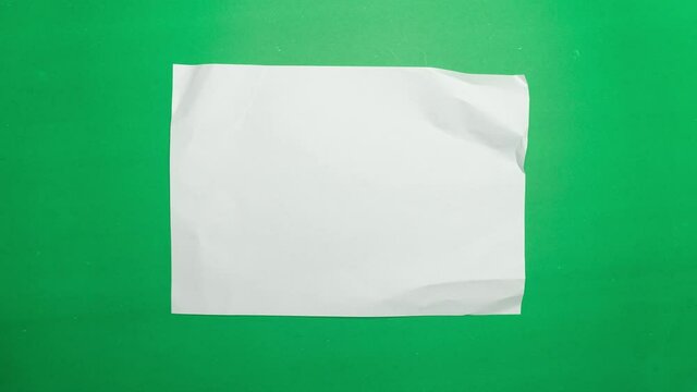 Stop motion animation paper wrinkles making a paper ball