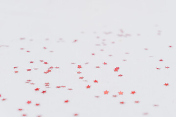 Christmas and festive background of red stars. Selective focus.