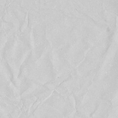 White vintage and old looking crumpled paper background. Retro cardboard texture. Grunge paper for drawing. Ancient book page. Present wrapping.