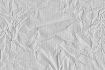 White vintage and old looking crumpled paper background. Retro cardboard texture. Grunge paper for drawing. Ancient book page. Present wrapping.