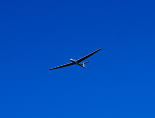 Single seat glider in flight over German countryside near Baden Baden_Baden Wuerttemberg, Germany