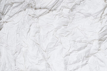 Crumpled white paper background.