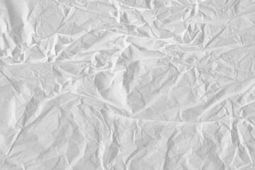 White vintage and old looking crumpled paper background. Retro cardboard texture. Grunge paper for...