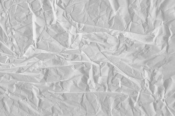 White vintage and old looking crumpled paper background. Retro cardboard texture. Grunge paper for drawing. Ancient book page. Present wrapping.