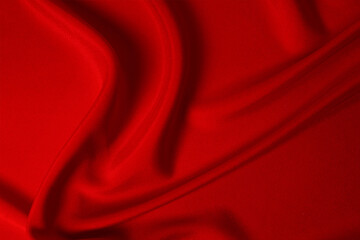 Red silk or satin luxury fabric texture can use as abstract background. Top view.