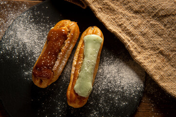 Eclairs. Eclairs are on the table. Confectionery. Serving. Decoration.