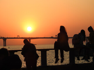 People admiring the sea sunset 