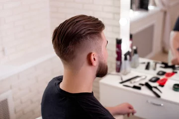 Foto auf Glas Male head with stylish haircut on barbershop background © Galina