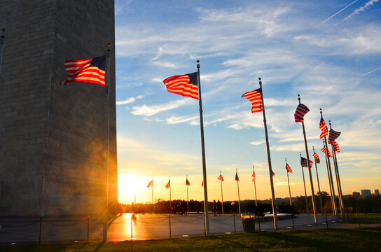 U.S. National Flags And Washington Monument During Sunset - Washington D.C. Unied Staes Of America