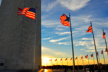 U.S. national flags and Washington Monument during sunset - Washington D.C. Unied Staes of America