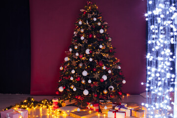 Light garland Christmas tree decor presents new year night interior