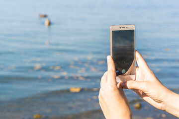 Hands with Modile Phone Making Photo of Landscape