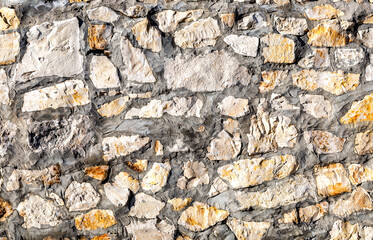 Rough stone wall as creative background texture