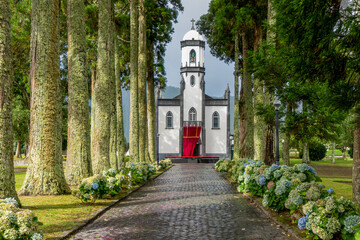 Fototapeta premium Azores, island of Sao Miguel, in the small village of Sete Cidades the church of Sao Nicolau