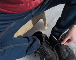 man putting warm winter boots