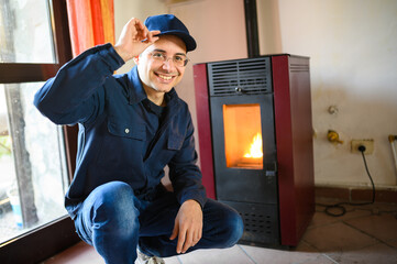 Technician maintaining a pellet stow heater