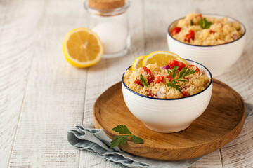 Tabouleh is an Arabic vegetarian salad made with couscous, tomatoes, parsley, onion and lemon...