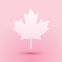 Paper cut Canadian maple leaf icon isolated on pink background. Canada symbol maple leaf. Paper art style. Vector.