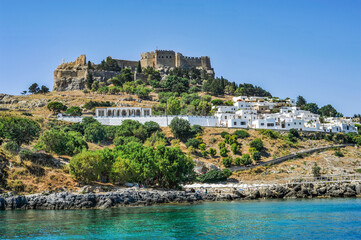 The quarter of the most respectable villas in Lindos is located directly above the harbor on the...