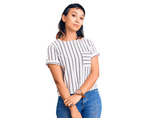 Fototapeta premium Young woman wearing casual clothes looking sleepy and tired, exhausted for fatigue and hangover, lazy eyes in the morning.