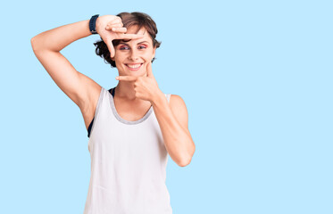 Fototapeta premium Beautiful young woman with short hair wearing casual sport clothes smiling making frame with hands and fingers with happy face. creativity and photography concept.