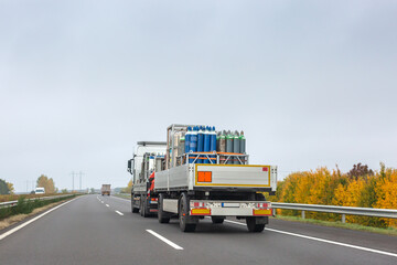Transportation of cylinders with oxygen for patients with coronavirus. Truck delivering gas cylinders for medical purposes