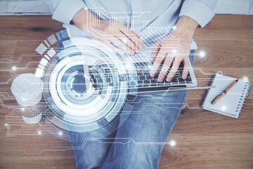 Multi exposure of technology hologram with man working on computer background. Concept of big data.