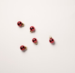 Small Christmas balls of red color, isolated on white background, top view shot