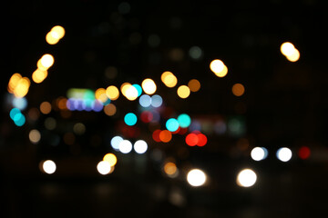 Blur city light of cars headlights on the night road. Colorful urban abstract background