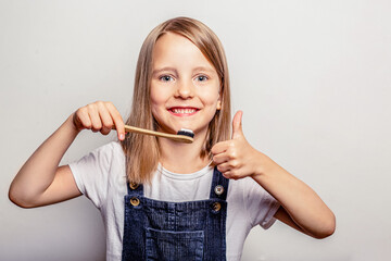 A child with a toothbrush in his hands