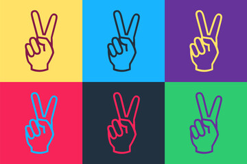 Obraz premium Pop art Hand showing two finger icon isolated on color background. Victory hand sign. Vector.
