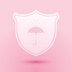Paper cut Waterproof icon isolated on pink background. Shield and umbrella. Protection, safety, security concept. Water resistant symbol. Paper art style. Vector.