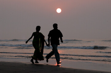 family walking on the beach