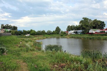 Obraz premium Cloudy summer day at the village