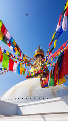 The Bouddhanath Temple in Kathmandu, Nepal. The temple has many colourful prayer flags with 'om...