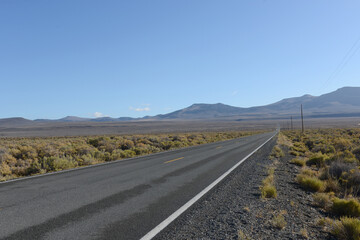 Road across a desert valley 