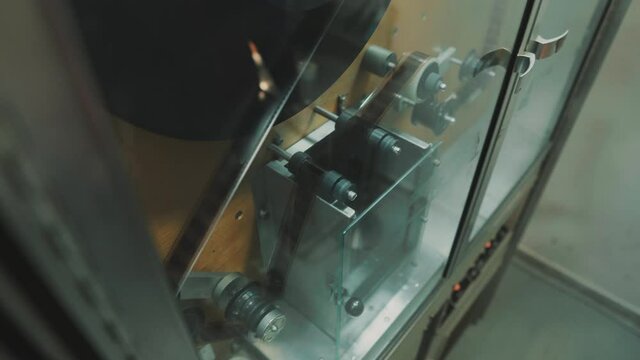 Machine for cleaning and restoration of old film tape