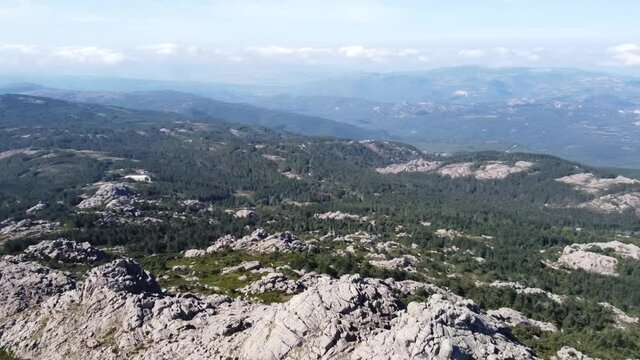 Circle with the drone in Sardinia's mountain landscape over Monte Limbara