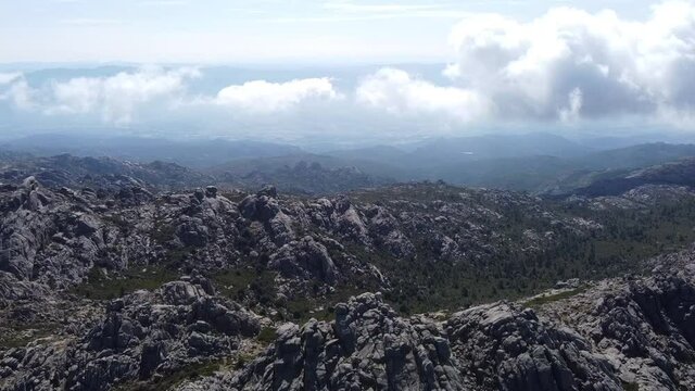 some clouds and fog over sardinias monte limbara, drone flight