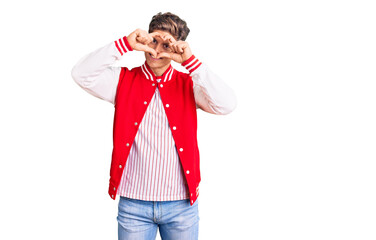 Young handsome man wearing baseball uniform doing heart shape with hand and fingers smiling looking through sign