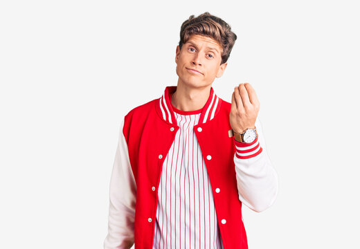 Young handsome man wearing baseball uniform doing italian gesture with hand and fingers confident expression